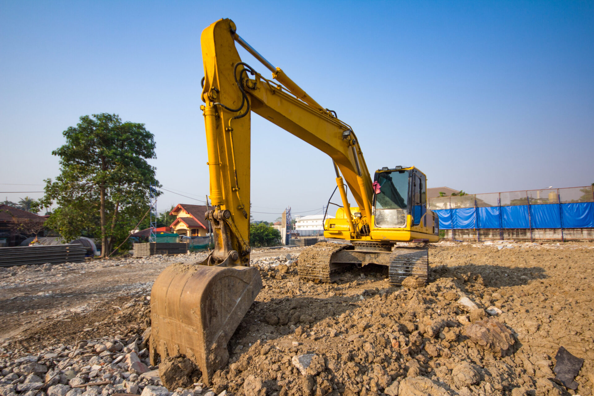 Yellow Backhoe Loader On Construction Site And Work