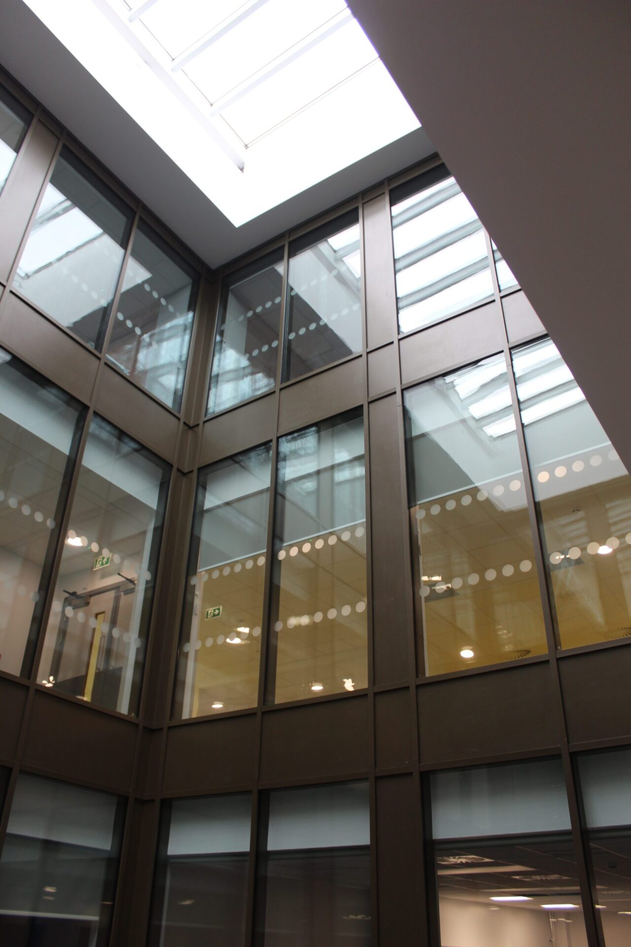A triple-height atrium is the centrepiece of the building's reception