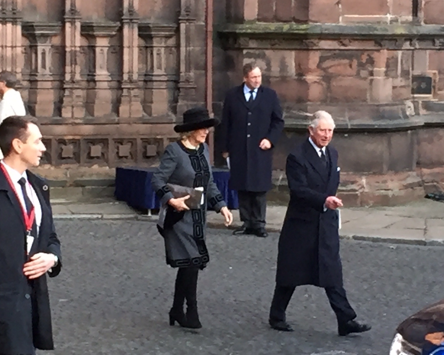 Camilla and Charles head to the car after the service