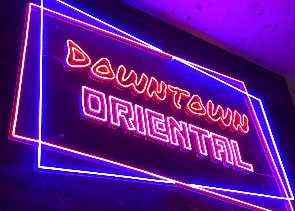 Neon sign for the Downtown Oriental food hall at Hello Oriental. Credit: PNW